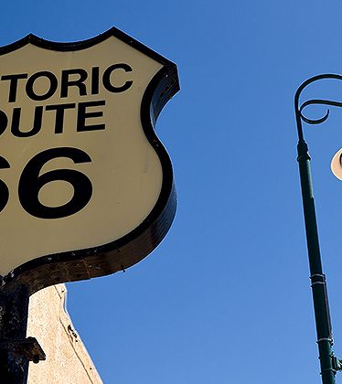 a sign and a lamp post
