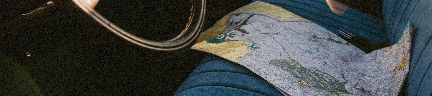 a map on the seat of a car